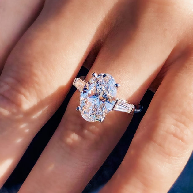 Oval Cut Diamond Engagement Ring with Tapered Baguette Side