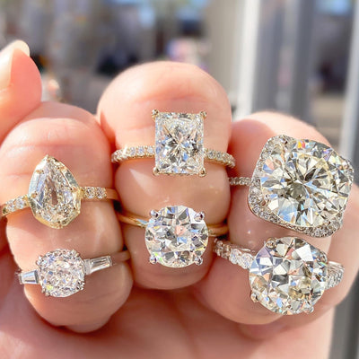 Assorted diamond engagement rings featuring pear, radiant, cushion, and round brilliant cuts, handcrafted by Shapiro Diamonds in Dallas