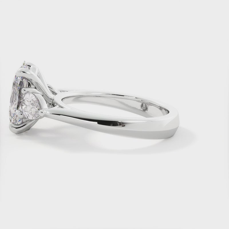 Oval and Pear Shape Three Stone Diamond Ring