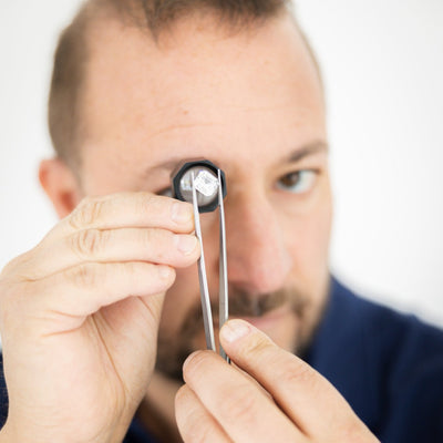 Diamond expert at Lance Shapiro inspecting a loose diamond in Dallas, Texas. 